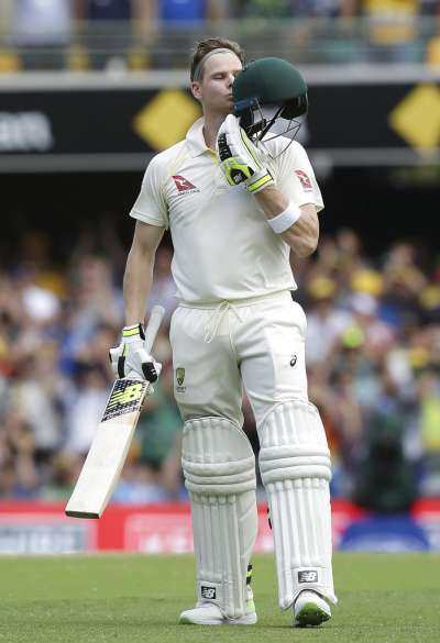Steve Smith confirmed his captaincy qualities again by grafting for 8 &frac12; hours in a crucial unbeaten 141, dragging Australia out of serious trouble and into positive territory on Saturday in the Ashes series opener. His 326-ball innings wrested control from England after three wickets tumbled in the morning session, and gave Australia the upper hand by stumps on day three. Australia's Steve Smith celebrates reaching his hundred runs during the Ashes cricket test between England and Australia in Brisbane, Australia.