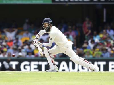 England struggled after a contentious stumping decision against Moeen Ali in the middle session on day four and was bundled out for 195 after a late collapse of 410, including the last three wickets for one run in 10 deliveries. England's Moeen Ali plays a shot against Australia during their Ashes cricket test in Brisbane, Australia.