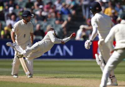 Nathan Lyon took a stunning return catch among his four wickets as Australia bowled England out for 227 just after dinner on the third day, a 215-run deficit that gave Smith the option of sending the tourists straight back in and attempts to compound their woes under lights. Australia's Nathan Lyon, second left, catches out England's Moeen Ali, second right, for 25 runs during the third day of their Ashes cricket test match in Adelaide.