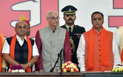 Gujarat CM Vijay Rupani and Deputy CM Nitin Patel along with Governor Om Prakash Kohli during the swearing-in ceremony at Gandhinagar on Tuesday