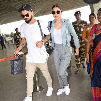 Newly-wed Anushka-Virat spotted at the airport this morning leaving for Bangalore