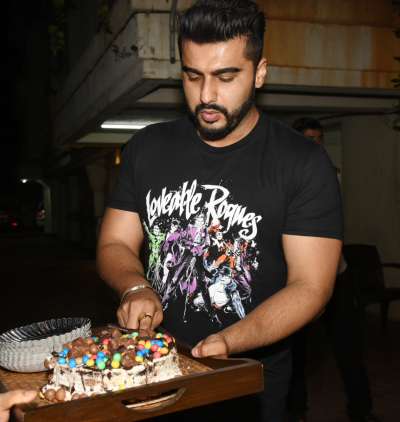 Bollywood actor Arjun Kapoor celebrated his 33rd birthday on Tuesday. On the occasion, the actor obliged the media and fans by cutting the cake with them and clicking pictures. Later he threw a bash for his industry friends which included Varun Dhawan, cousin Harshvardhan Kapoor and Mohit Marwah and sisters Anshula Kapoor and Janhvi Kapoor.&amp;nbsp;