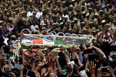 Thousands gathered to pay their last respects to DMK chief M Karunanidhi as his cortege passed through the streets of Chennai, on Wednesday, August 8, 2018. (PTI Photo)