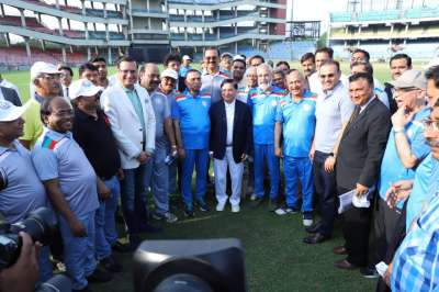 Former India opener Virender Sehwag poses for a group picture along with DDCA President Rajat Sharma and CJI Dipak Misra ahead of Supreme Court Bar Association XI vs Chief Justice XI annual T20 match.