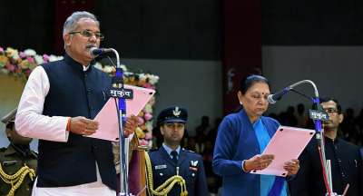 Chhattisgarh Chief Minister Bhupesh Baghel being administered the oath of office by Governor Anandiben Patel during a swearing-in ceremony, in Raipur