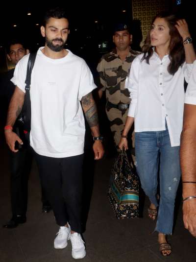 Love birds Virat Kohli and Anushka Sharma look stunning as they got clicked at the airport twinning in white