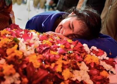 Allahabad: A family member of slain CRPF Mahesh Yadav cries before his funeral at Tudihar, in Allahabad district, Saturday, Feb. 16, 2019. Yadav lost his life in Pulwama terror attack.