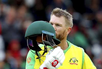Australia moved closer to World Cup semifinals after David Warner inspired the defending champions to a comfortable 48-run
