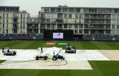 Ground staff work to clear water off the outfield prior to the Cricket World Cup match between Pakistan and Sri Lanka, at Bristol County Ground, in Bristol, England