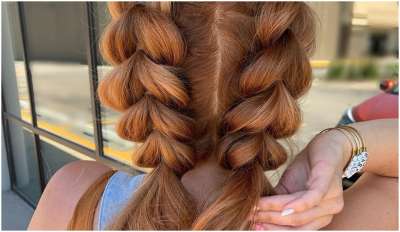 If you have frizzy hair, then this fluffy braided two pony is made for you. Set your hair with spray before you start braiding to add some grit and hold onto this easy hairstyle.
