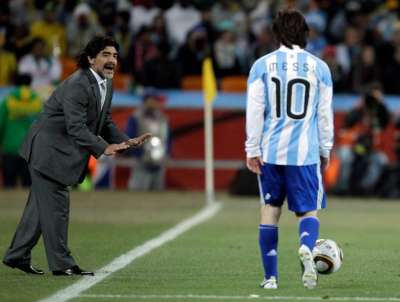 Maradona gives instructions to Argentina's Lionel Messi during the World Cup round of 16 soccer match between Argentina and Mexico.