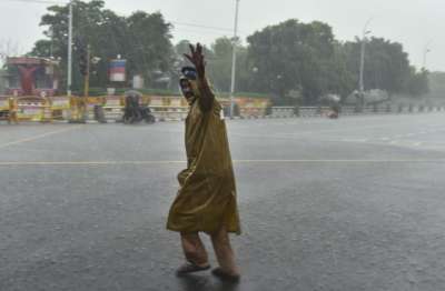 Chennai: A policeman gestures as he manages traffi