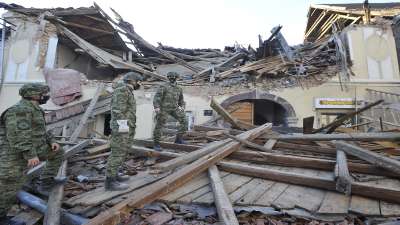 Soldiers inspect the remains of a building damaged in an earthquake, in Petrinja, Croatia, Tuesday, Dec. 29, 2020.&amp;nbsp;
