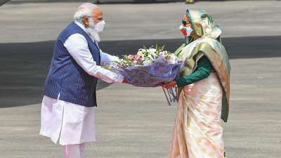 Prime Minister Narendra Modi being received by Bangladesh PM Sheikh Hasina, in Dhaka.