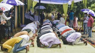 Devotees offer Namaz under Covid protocol on the occasion of Eid al-Adha at Eidgah in Lucknow.