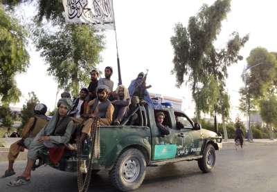 Taliban fighters patrol inside the city of Kandahar, southwest.&amp;nbsp;