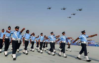 Ghaziabad: Indian Air Force (IAF) personnel march past as IAF helicopters perform an air display during 89th foundation day of the force, at Hindan Airbase