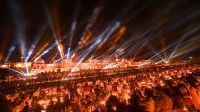 Devotees witness laser show on the bank of Saryu River during Deepotsav celebrations in Ayodhya.