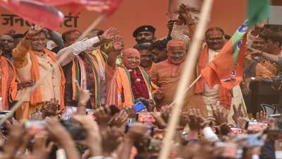 UP Chief Minister Yogi Adityanath waves at the supporters after his victory in UP Assembly polls during a celebration at the party office, in Lucknow on March 10, 2022.&amp;nbsp;
&amp;nbsp;