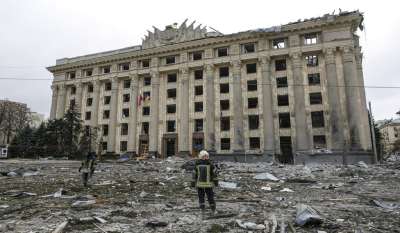 A member of the Ukrainian Emergency Service looks at the City Hall building in the central square following shelling in Kharkiv, Ukraine, Tuesday, March 1, 2022.&amp;nbsp;Casualties mounted and reports emerged that more than 70 Ukrainian soldiers were killed after Russian artillery recently hit a military base in Okhtyrka, a city between Kharkiv and Kyiv, the capital.&amp;nbsp;