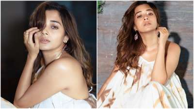 Tina Datta gave summer fashion goals to her fans as she shared pictures wearing a beautiful strappy gown. She looked beautiful in loose curls and statement earrings.