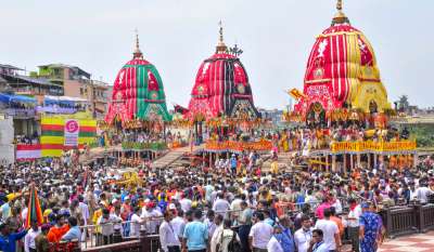 Devotees throng the chariots of Lord Jagannath, Lord Balabhadra and Goddess Subhadra during the annual Rath Yatra of Lord Jagannath, in Puri, Friday, July 1, 2022. The Yatra commenced Friday after two years of a break due to the COVID-19 pandemic.