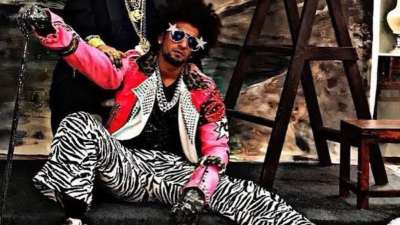 In zebra print pants and a pink funky coat and feather hat, Ranveer yet again impressed with his styling choice