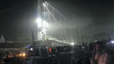 Morbi: Rescue operation underway after an old suspension bridge over the Machchhu river collapsed, in Morbi district on Sunday.