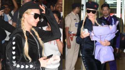 American socialite Paris Hilton arrived at the Mumbai airport in an all-black outfit as she happily posed for the shutterbugs stationed outside the venue.
