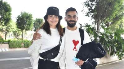 Virat Kohli and Anushka Sharma were spotted at the airport on Wednesday. The couple won everybody's hearts as they were seen dressed in similar attires. Virushka fans are loving the couple's outfit choice.
