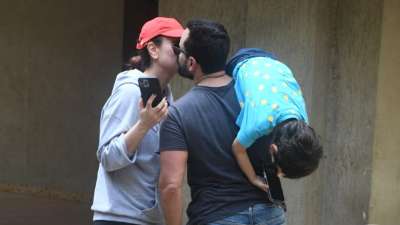 Kareena Kapoor and Saif Ali Khan were spotted right below their residence as they shared a cute kiss moment. 
