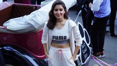 Anushka Sharma looks super cute during the promotions of a sports brand. She wore a cool white sports bra with white flared pants, pairing them with a white jacket. 