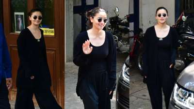 Bollywood actress Alia Bhatt looked cute in an all-black outfit. She simply opted for a 'No-makeup look'. The newly turned mother was all smiles for the camerapersons.