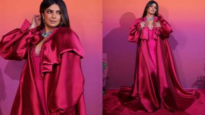 Priyanka Chopra effortlessly carried this pink satin outfit with a contrast neckpiece.