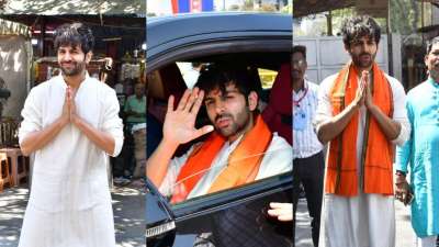 Kartik Aaryan in white kurta-pyjama visited Mumbai's Siddhivinayak Temple to seek blessings of the Almighty on Friday afternoon. He greeted the paparazzi with folded hands.