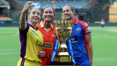 UP Warriorz's captain Alyssa Healy, Gujarat Giants' Beth Mooney and Delhi Capitals' veteran Meg Lanning with the WPL 2024 trophy at Bengaluru's M Chinnaswamy Stadium on Wednesday. Last edition's finalists Mumbai Indians and Delhi Capitals will clash in the season opener on Friday, February 21. 