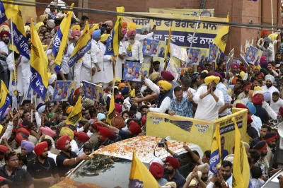 Delhi Chief Minister Arvind Kejriwal with Punjab counterpart Bhagwant Mann during a roadshow in Amritsar.