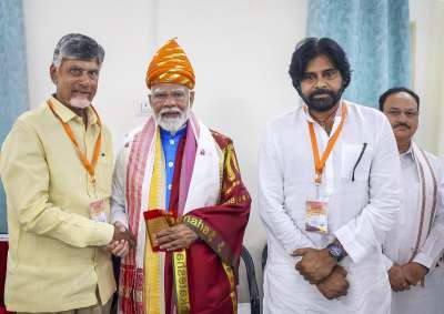 Prime Minister Narendra Modi is greeted by TDP president N Chandrababu Naidu and Jana Sena Party president Pawan Kalyan ahead of the filing of his nomination from Varanasi Lok Sabha constituency