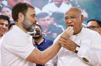 Congress MP Rahul Gandhi offers cake to party President Mallikarjun Kharge