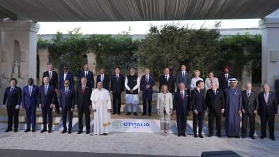 Pope Francis and leaders of G7 and from other guest nations, including PM Narendra Modi, stand for a family photo at the summit in Italy