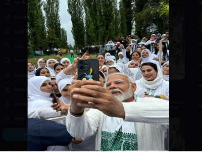 PM Modi takes post-yoga selfies in Srinagar, marking the end of a mega event on the bank of Dal Lake.