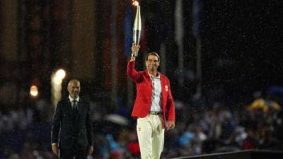 The Paris Olympics opening ceremony got underway as the Olympic torch was handed to the French footballer Zinedine Zidane before being passed on to tennis veteran Rafael Nadal. Notably, the torch completed a three-month journey from Greece to Paris.