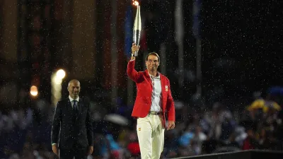 The Paris Olympics opening ceremony got underway as the Olympic torch was handed to the French footballer Zinedine Zidane before being passed on to tennis veteran Rafael Nadal. Notably, the torch completed a three-month journey from Greece to Paris.