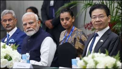 Prime Minister Narendra Modi with his Singapore counterpart Lawrence Wong at the AEM Holdings semiconductor facility.