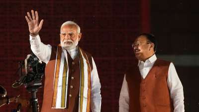 Prime Minister Narendra Modi and Union Minister and BJP National President JP Nadda greet the gathering at the party headquarters after the declaration of results for the Haryana and Jammu and Kashmir Assembly elections, in New Delhi, Tuesday, Oct. 8, 2024. 