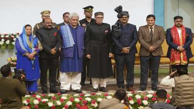 Omar Abdullah with LG Manoj Sinha and his new Cabinet after the swearing-in ceremony