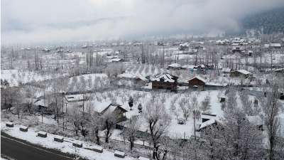 Houses in Baramulla covered with snow manifest the magnificent beauty of the 'heaven of the earth.' The pine, poplar and fir trees add to the serene landscape.