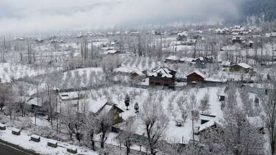 Jammu and Kashmir&rsquo;s summer capital Srinagar experienced the coldest night of the season at minus six degrees Celsius. The picture shows houses covered in snow as many areas in the plains of Kashmir received the season's first snowfall. 