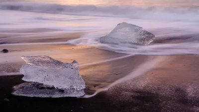 The Diamond Beach in Iceland is a black volcanic sand beach where icebergs from the Jokulsarlon glacier lagoon drift ashore. 