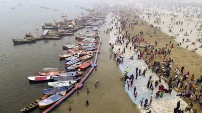 Devotees take a holy dip at Sangam ahead of Mahakumbh mela 2025, in Prayagraj. 